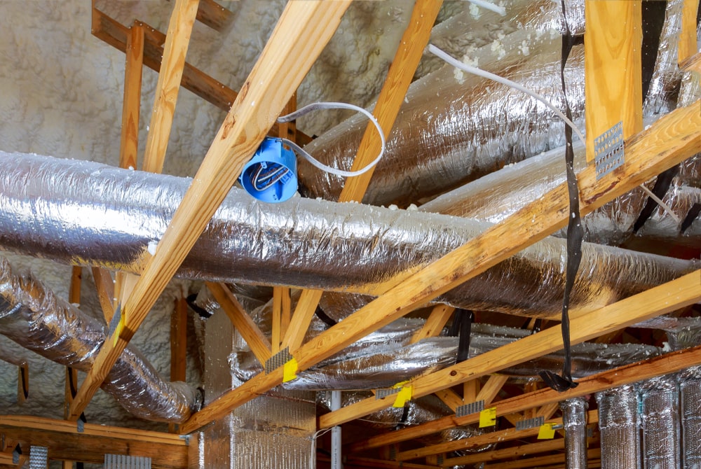 Air duct system over wooden beams